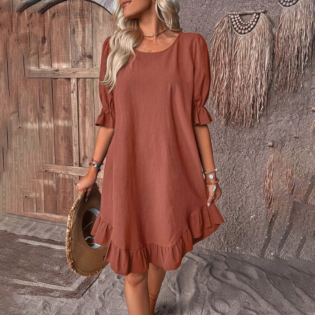 Mia Elegante jurk met pofmouwen