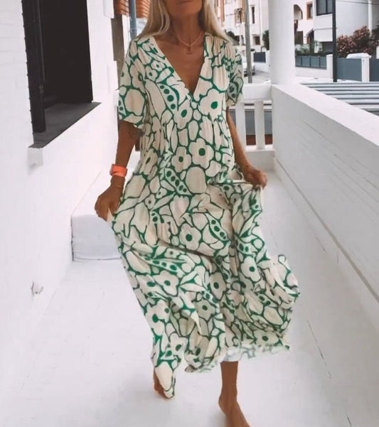 Elegante midi-jurk met V-hals en zacht patroon