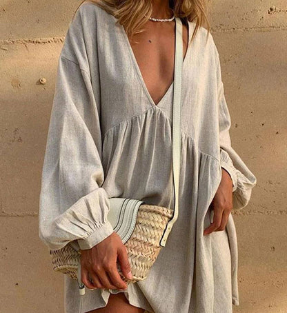 Nikita Casual jurk met Vhals en geplooide lantaarnmouwen