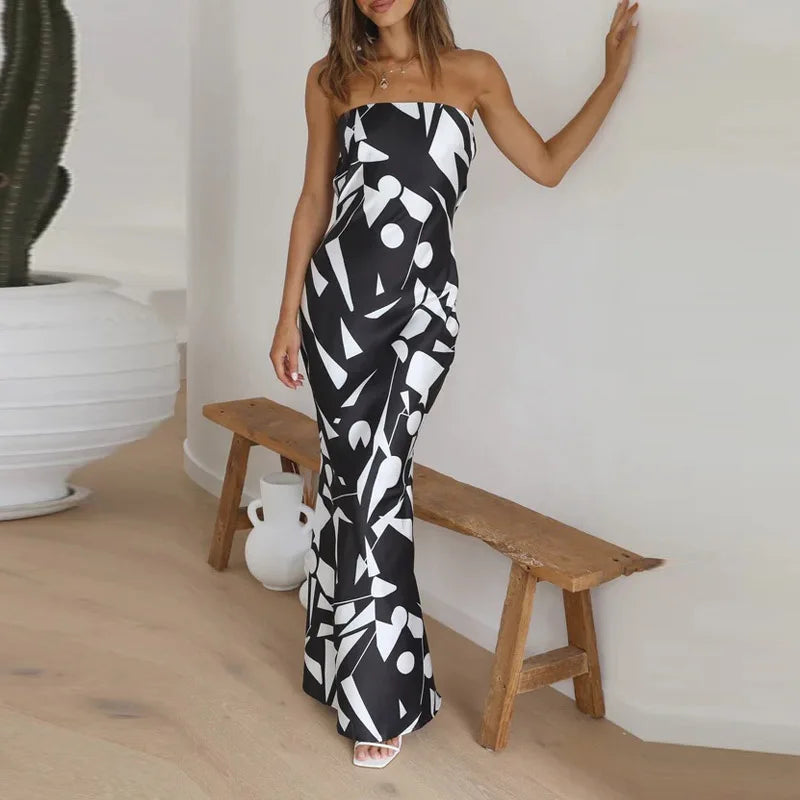 Maxi-jurk dicht op de schouder met geometrische print