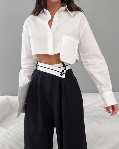 Mona - Broek met wijde pijpen en asymmetrische tailleband
