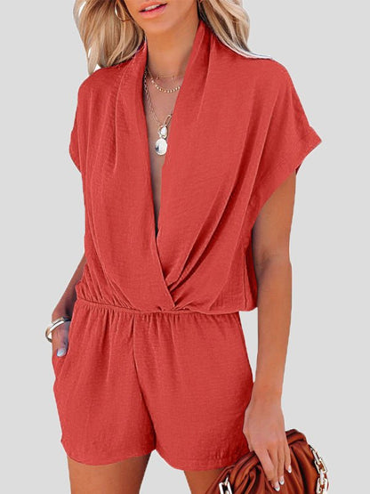 -jumpsuit met een diepe pasvorm en gekruiste zakken voor een losse pasvorm.
